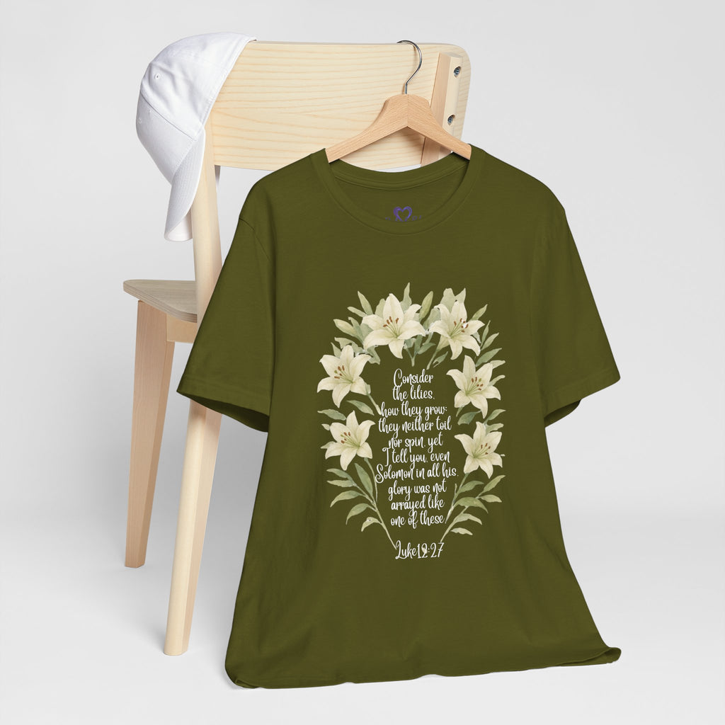 “Watercolor lily Christian t-shirt featuring Luke 12:27. A soft, faith-inspired reminder to trust God’s care. Beautiful gift for women of faith, Bible study, or everyday encouragement.”